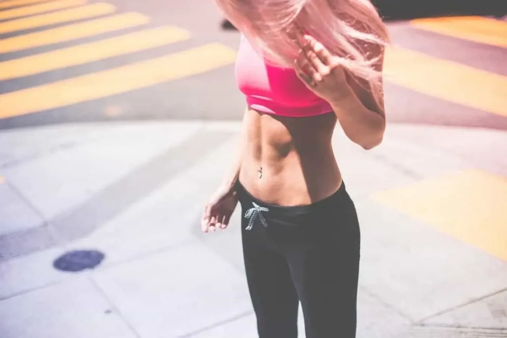 Woman with toned stomach after LA-EMS Body Sculpting Treatment West Ealing