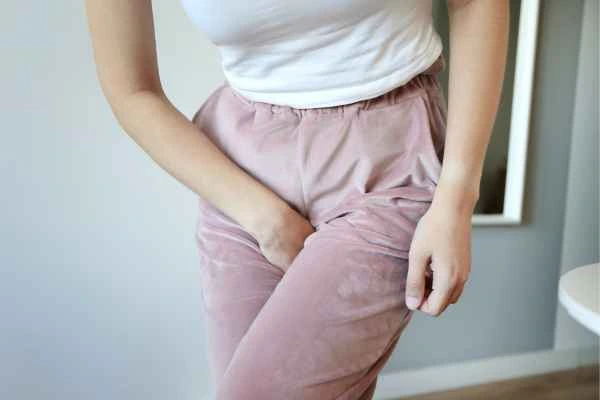 woman running for the toilet because of urinary incontinence West Ealing